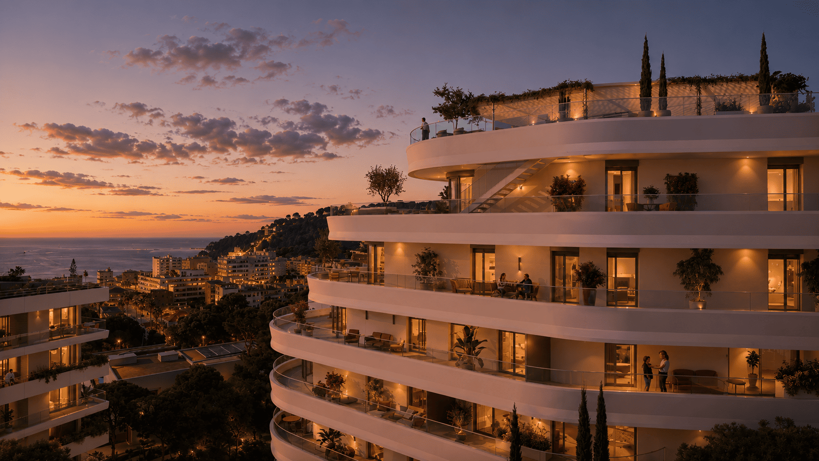 building exterior with sea view at dusk - Coeur de Carnolès, new apartments for sale in Roquebrune-Cap-Martin